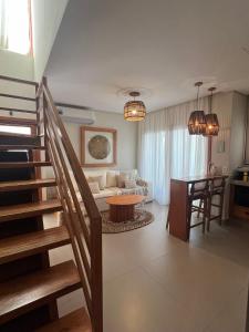 a living room with a staircase and a couch and a table at Sunny Kite House Prea in Prea +27 photos