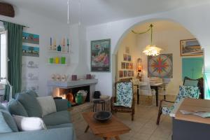 a living room with a couch and a table at Trulli Mirabilis in Cisternino