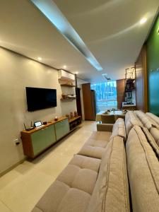 TV a/nebo společenská místnost v ubytování Flat Tapajós Alter 2 quartos, cozinha, climatizado, wifi 200mbps, estacionamento e self check-in