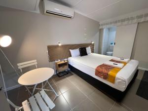 Postel nebo postele na pokoji v ubytování Kalua Motel