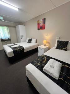 Postel nebo postele na pokoji v ubytování Kalua Motel