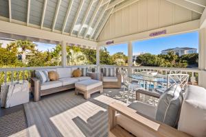 a living room with a couch and a table at High Seas in DeBordieu Colony home by Peace Vacations in Georgetown