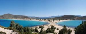 a view of a beach with trees and blue water at Simosmare Resort in Elafonisos