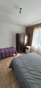 Ένα ή περισσότερα κρεβάτια σε δωμάτιο στο Casa Martina +1 φωτογραφίες