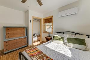 a bedroom with a bed and a dresser at Remote Home with Deck and Grill in Scenic Tuckasegee! in Tuckasegee