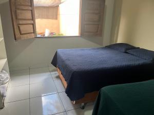 En eller flere senge i et værelse på Meu cantinho 3