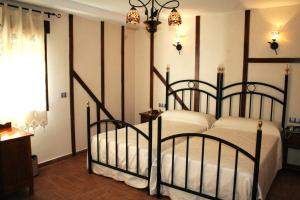 Postel nebo postele na pokoji v ubytování Hotel Casa Beletri