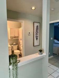 a bathroom with a sink and a toilet in a room at Dee's Dream Sunset Condo - #151 in Key West