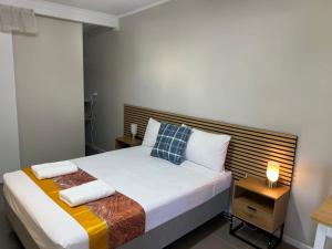 Postel nebo postele na pokoji v ubytování Kalua Motel