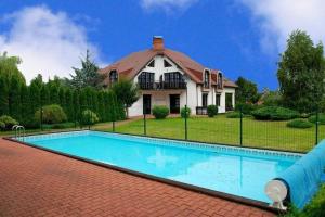 a house with a swimming pool in front of a house at Villa in Brenna near Ski Lifts in Brenna