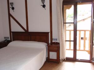 Postel nebo postele na pokoji v ubytování Hotel Casa Beletri