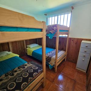 Postel nebo postele na pokoji v ubytování Cabañas y Tinajas Borde río