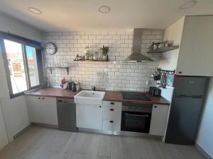 A kitchen or kitchenette at Sea View Penthouse with Large Terrace