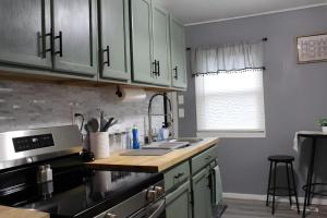 a kitchen with a sink and a counter top at HiddenJewel in Springfield