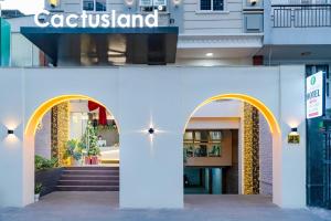 a facade of a building with two archways at Cactusland Hotel Tan Binh Near T3 Station in Ho Chi Minh City