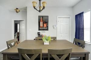 a dining room with a table and chairs at Spacious Family Retreat - Churchill Downs & Downtown in Louisville +34 photos