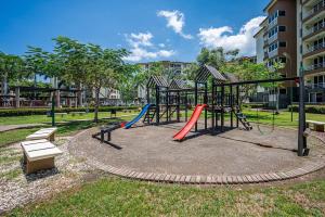 a park with a playground with a slide at 2-17 Jaco Beach Beautiful Costa Linda Condo in Jacó
