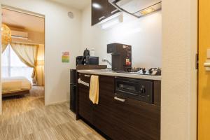 Eldhús eða eldhúskrókur á だるまマンション903