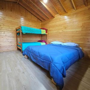 Postel nebo postele na pokoji v ubytování Cabaña Los Alerces