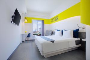 Postel nebo postele na pokoji v ubytování Yello Hotel Jemursari + 37 fotografií