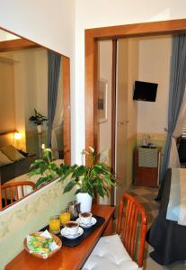 a room with a table with food on it at Hotel Carmel in Rome