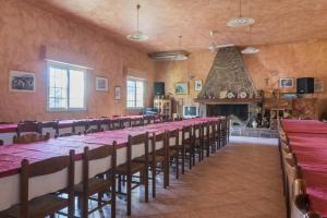 a large room with a long table and chairs at Agriturismo Le Mimose in Arborea 