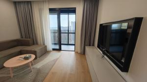 Μια τηλεόραση ή/και κέντρο ψυχαγωγίας στο Adoor Suites Shenzhen
