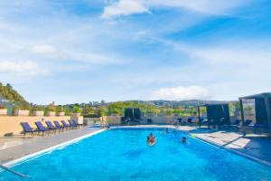 Bazén v ubytování Grand Hotel Tijuana nebo v jeho okolí