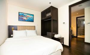 Ένα ή περισσότερα κρεβάτια σε δωμάτιο στο The Sapphire Resident S1 +30 φωτογραφίες