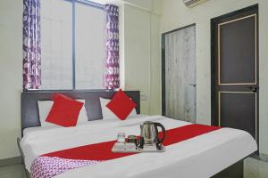 Postel nebo postele na pokoji v ubytování Hotel O R K Exclusive