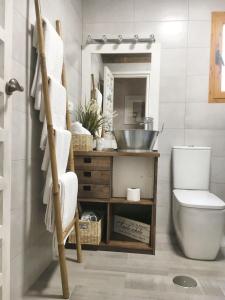 a bathroom with a toilet and a sink at Charming apartment in Cuenca with fireplace - 80 sqm in Cuenca +47 photos