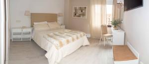 Postel nebo postele na pokoji v ubytování Ares Hotel