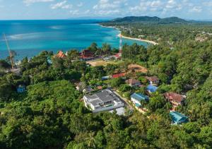 an aerial view of a resort next to the ocean at Villa Amour 3 Bedroom Spa Pool Retreat near Beach - Lamai in Amphoe Koh Samui