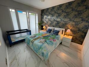 a bedroom with a large bed in a room at St George in Antibes