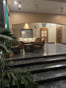 TV a/nebo společenská místnost v ubytování Kaashi Flora - Room Wise