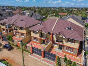 an overhead view of a house with a roof at Pacific Times homestays in Ruiru