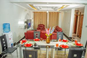 a living room with a table and a couch at Pacific Times homestays in Ruiru