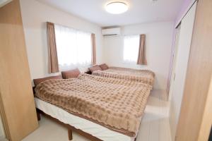 Habitacion ToWa房間的床