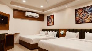 Giường trong phòng chung tại Soil to Soul Trinity Hotel - A Boutique Stay