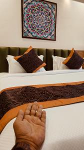 Giường trong phòng chung tại Soil to Soul Trinity Hotel - A Boutique Stay