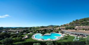 an overhead view of a swimming pool at a resort at Chia Laguna - Hotel Village in Chia