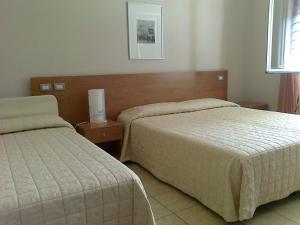 Un pat sau paturi într-o cameră la Al Flor