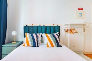 Ένα ή περισσότερα κρεβάτια σε δωμάτιο στο Alfama Comfy Studio