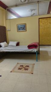 Ένα ή περισσότερα κρεβάτια σε δωμάτιο στο Durga Niwas