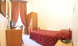 Postel nebo postele na pokoji v ubytování Hotel Euro Quiris
