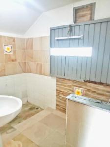 a bathroom with a sink and a toilet in it at Seasonsamed Resort in Ao Phutsa