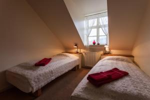 Ένα ή περισσότερα κρεβάτια σε δωμάτιο στο Guesthouse Gamla
