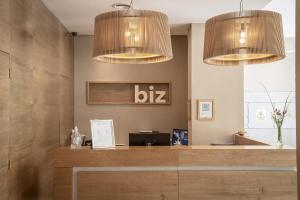 an office with two chandeliers above a desk at Brizo Neuquén in Neuquén
