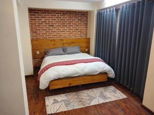 Voodi või voodid majutusasutuse Pilachhen Community Homestay Lacchi Photo Saino toas