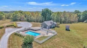 an aerial view of a home with a swimming pool at Whiskey River Lake Retreat in Taylorsville